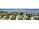 Waterfront home featuring well-manicured lawns and private docks for access to the lake at 4099 Island Lakes Dr, Winter Haven, FL 33881