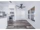 This kitchen includes stainless appliances, white cabinets and countertops, gray floors, and bright natural light at 4099 Island Lakes Dr, Winter Haven, FL 33881