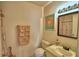 A cozy bathroom featuring a decorated mirror and decorated towels at 4229 Nandina St, Lake Wales, FL 33898
