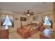 A comfortable bedroom featuring natural light, a ceiling fan and a wooden bed set at 4229 Nandina St, Lake Wales, FL 33898
