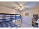 Comfortable bedroom featuring a bunk bed with a ceiling fan and TV at 4229 Nandina St, Lake Wales, FL 33898