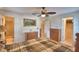 A bedroom with 2 dressers, ceiling fan and connected bathroom and closet at 4229 Nandina St, Lake Wales, FL 33898