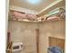 Walk-in closet with wire shelving, including some storage containers and personal items at 4229 Nandina St, Lake Wales, FL 33898