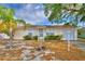 Charming single-story home featuring a well-maintained lawn and inviting curb appeal with palm tree at 4229 Nandina St, Lake Wales, FL 33898