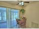 Bright kitchen features tile floors, table with chairs, and sliding door at 4229 Nandina St, Lake Wales, FL 33898