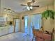 Cozy kitchen with tile floor features white appliances and a ceiling fan at 4229 Nandina St, Lake Wales, FL 33898