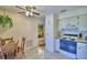 Efficient kitchen includes tile flooring, oven and a cozy dining area with a ceiling fan at 4229 Nandina St, Lake Wales, FL 33898