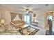 Cozy living room with tile flooring, ceiling fan, comfortable couches and a decorative rug at 4229 Nandina St, Lake Wales, FL 33898
