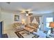 Cozy living room with tile flooring, ceiling fan, comfortable couches and a decorative rug at 4229 Nandina St, Lake Wales, FL 33898