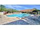 Beautiful community pool with lounge seating and nearby clubhouse for leisure and recreation at 4229 Nandina St, Lake Wales, FL 33898