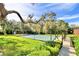 A shuffleboard court, offering an outdoor activity space with shade and seating at 4229 Nandina St, Lake Wales, FL 33898