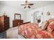 Bedroom featuring a large dresser and a large decorative bed with a view to an en-suite bathroom at 4313 Heath Land Ln, Lake Wales, FL 33859