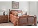 Bedroom features a decorative bed with nightstands, lamps, and patterned bedding at 4313 Heath Land Ln, Lake Wales, FL 33859