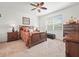 Bedroom featuring a woven-style bed, ceiling fan, carpet, and neutral walls with a warm aesthetic at 4313 Heath Land Ln, Lake Wales, FL 33859