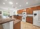 A kitchen featuring stainless steel appliances, granite countertops, and an adjacent dining area at 4313 Heath Land Ln, Lake Wales, FL 33859