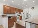 A spacious kitchen with stainless steel appliances, granite countertops and abundant cabinet storage space at 4313 Heath Land Ln, Lake Wales, FL 33859