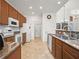 Spacious kitchen with granite countertops, tile flooring, and a view into the living spaces at 4313 Heath Land Ln, Lake Wales, FL 33859