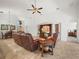 Bright living room with elegant furniture, tile flooring, and an open layout connecting to the dining area at 4313 Heath Land Ln, Lake Wales, FL 33859