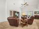 Comfortable living area with a vaulted ceiling, fireplace, and a TV entertainment center at 4313 Heath Land Ln, Lake Wales, FL 33859