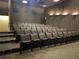 This theater features tiered seating, comfortable chairs, and modern lighting for a superb entertainment experience at 4313 Heath Land Ln, Lake Wales, FL 33859