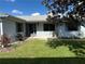 Charming home with well-kept lawn, mature tree providing shade and a quaint entrance at 460 Pinehurst Ct, Winter Haven, FL 33884