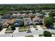 Aerial view of the neighborhood and home with solar panels at 4610 Yellow Bay Dr, Kissimmee, FL 34758