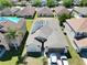 Aerial view of the house with solar panels on the roof at 4610 Yellow Bay Dr, Kissimmee, FL 34758