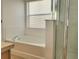 A serene bathroom featuring a soaking tub and separate shower at 4610 Yellow Bay Dr, Kissimmee, FL 34758