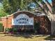 Community sign for Hammock Trails, a deed restricted community, with brick facade and manicured landscaping at 4610 Yellow Bay Dr, Kissimmee, FL 34758