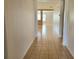 Hallway featuring tile flooring and a view into the living area at 4610 Yellow Bay Dr, Kissimmee, FL 34758