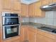The well-equipped kitchen features stainless steel appliances and plentiful cabinet storage at 4610 Yellow Bay Dr, Kissimmee, FL 34758