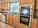 A bright kitchen boasts updated stainless steel appliances and ample cabinet space at 4610 Yellow Bay Dr, Kissimmee, FL 34758