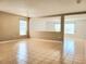 Open living room with tile floors, neutral paint, and large windows at 4610 Yellow Bay Dr, Kissimmee, FL 34758