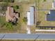 Aerial view of a home and its surroundings with a well-maintained lawn at 4957 Old Lucerne Park Rd, Winter Haven, FL 33881