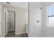 Bathroom features a glass-enclosed shower, modern fixtures and gray wood-look flooring at 4957 Old Lucerne Park Rd, Winter Haven, FL 33881