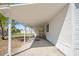 Covered carport and entrance to home with white siding at 4957 Old Lucerne Park Rd, Winter Haven, FL 33881