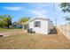 Exterior view of home with white siding and a covered carport at 4957 Old Lucerne Park Rd, Winter Haven, FL 33881