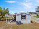 Exterior view of home with white siding and a covered carport at 4957 Old Lucerne Park Rd, Winter Haven, FL 33881