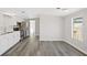 View of updated kitchen and eating area featuring new floors at 4957 Old Lucerne Park Rd, Winter Haven, FL 33881