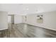 Spacious living room featuring wood-look floors and ample natural light at 4957 Old Lucerne Park Rd, Winter Haven, FL 33881