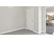 The room features light gray walls, a white door, and an outlet on the wall at 4957 Old Lucerne Park Rd, Winter Haven, FL 33881