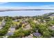 Scenic aerial view of the lakeside community homes with lush trees and lake views at 5020 Broadmore Dr, Auburndale, FL 33823