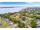 Picturesque aerial shot of lakeside community with mature landscaping and beautiful lake views at 5020 Broadmore Dr, Auburndale, FL 33823