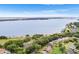 Waterfront homes boasting manicured lawns, mature landscaping, and panoramic lake views at 5020 Broadmore Dr, Auburndale, FL 33823