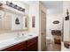 Bathroom with vanity featuring a light countertop and a wood-tone cabinet at 5020 Broadmore Dr, Auburndale, FL 33823