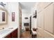 Cozy bathroom featuring tile floors, a stylish vanity, and charming decor at 5020 Broadmore Dr, Auburndale, FL 33823