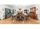 Spacious dining room featuring hardwood floors, a chandelier, and a vintage-style hutch at 5020 Broadmore Dr, Auburndale, FL 33823