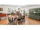 Bright dining room with hardwood floors and view of living room, offering a vintage hutch at 5020 Broadmore Dr, Auburndale, FL 33823