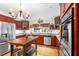 Well-lit kitchen with custom cabinets, stainless appliances, and a functional center island at 5020 Broadmore Dr, Auburndale, FL 33823