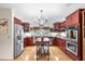 Bright kitchen with custom cabinets, stainless steel appliances, and a center island at 5020 Broadmore Dr, Auburndale, FL 33823